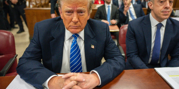 Former US President Donald Trump looks on during his criminal trial for allegedly covering up hush money payments at Manhattan Criminal Court, in New York City, on May 13, 2024 / ©AFP