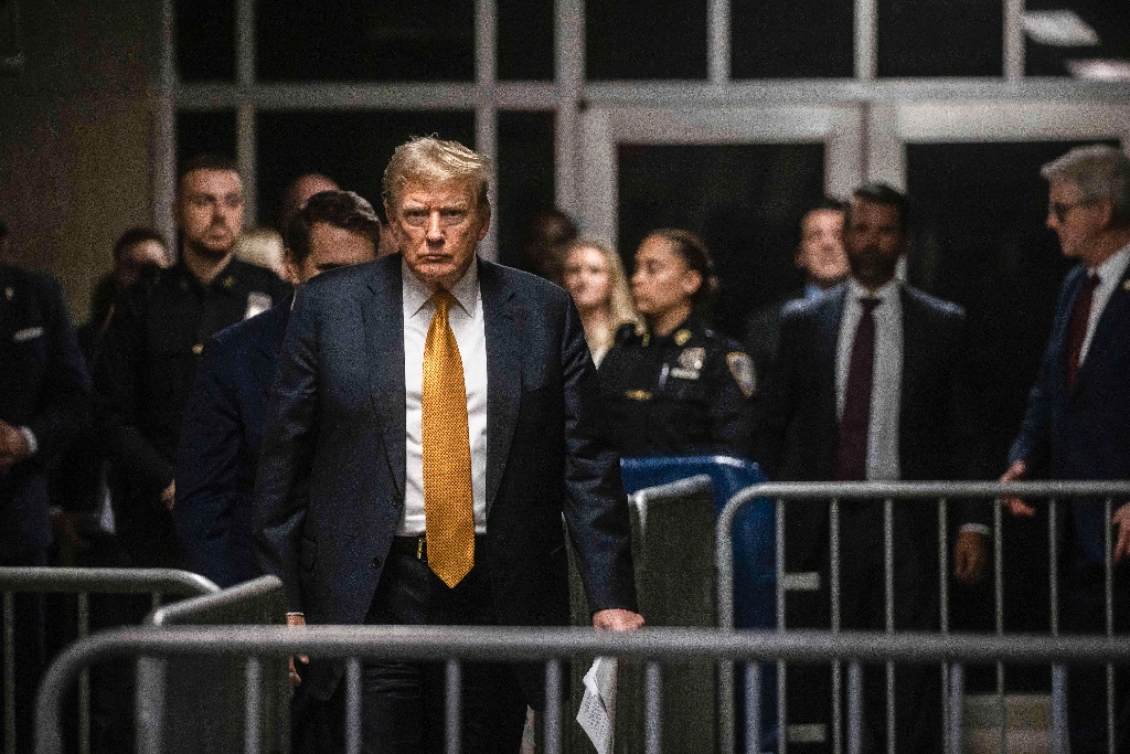 Former US president Donald Trump arrives to speak to the media at the end of the day's proceedings in his criminal trial at Manhattan Criminal Court / ©AFP