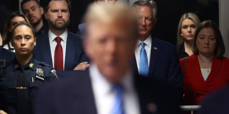 Former US president Donald Trump has been joined by allies from the US Senate including J.D. Vance (red tie) and Tommy Tuberville (to the right of Vance) as he attends court / ©AFP