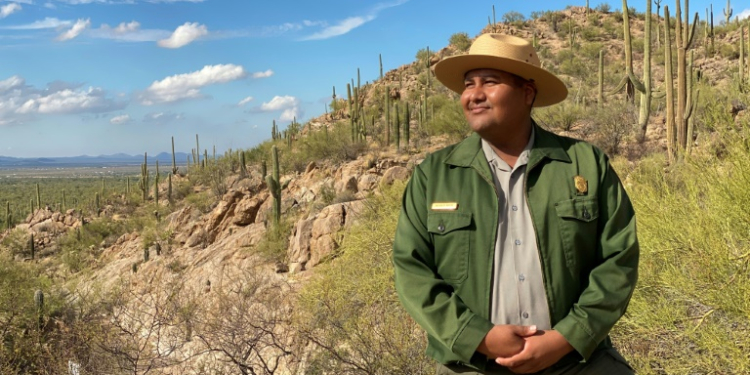 Raeshaun Ramon, ranger at Saguaro National Park, is proud to be the first member of his Native American community to work at the Arizona park. ©AFP