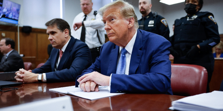 Former US President and Republican presidential candidate Donald Trump sits in the courtroom during his hush money trial at Manhattan Criminal Court on May 20, 2024 / ©AFP