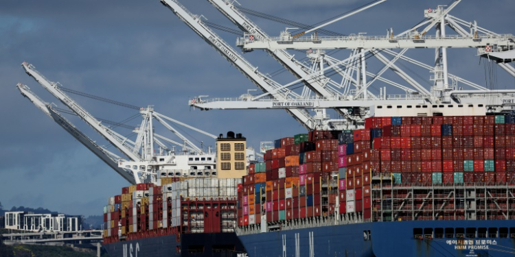 The US trade deficit narrows slightly to $69.4 billion in March, but the gap remains wider than analysts anticipated. ©AFP