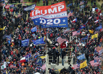 Some supporters of then-president Donald Trump flew 'Appeal to Heaven' flags, one of which is seen here in lower left corner, as they stormed the US Capitol on January 6, 2021 in an effort to block certification of President Joe Biden's election victory / ©AFP