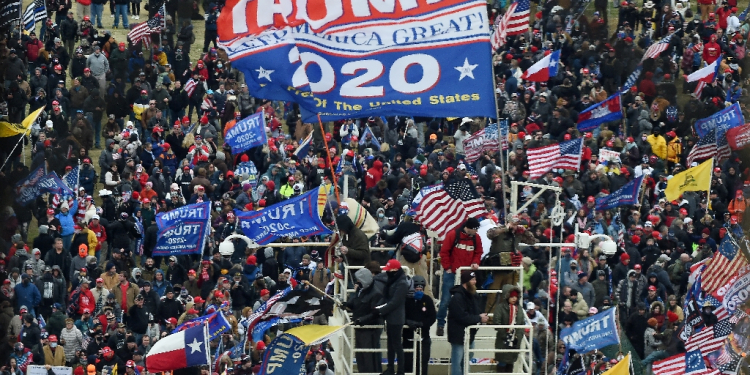 Some supporters of then-president Donald Trump flew 'Appeal to Heaven' flags, one of which is seen here in lower left corner, as they stormed the US Capitol on January 6, 2021 in an effort to block certification of President Joe Biden's election victory / ©AFP