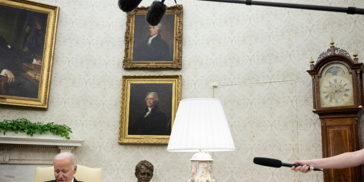 US President Joe Biden listens during a meeting with Romanian President Klaus Iohannis (out of frame) in the Oval Office -- but did not speak about Israel-Hamas ceasefire talks / ©AFP