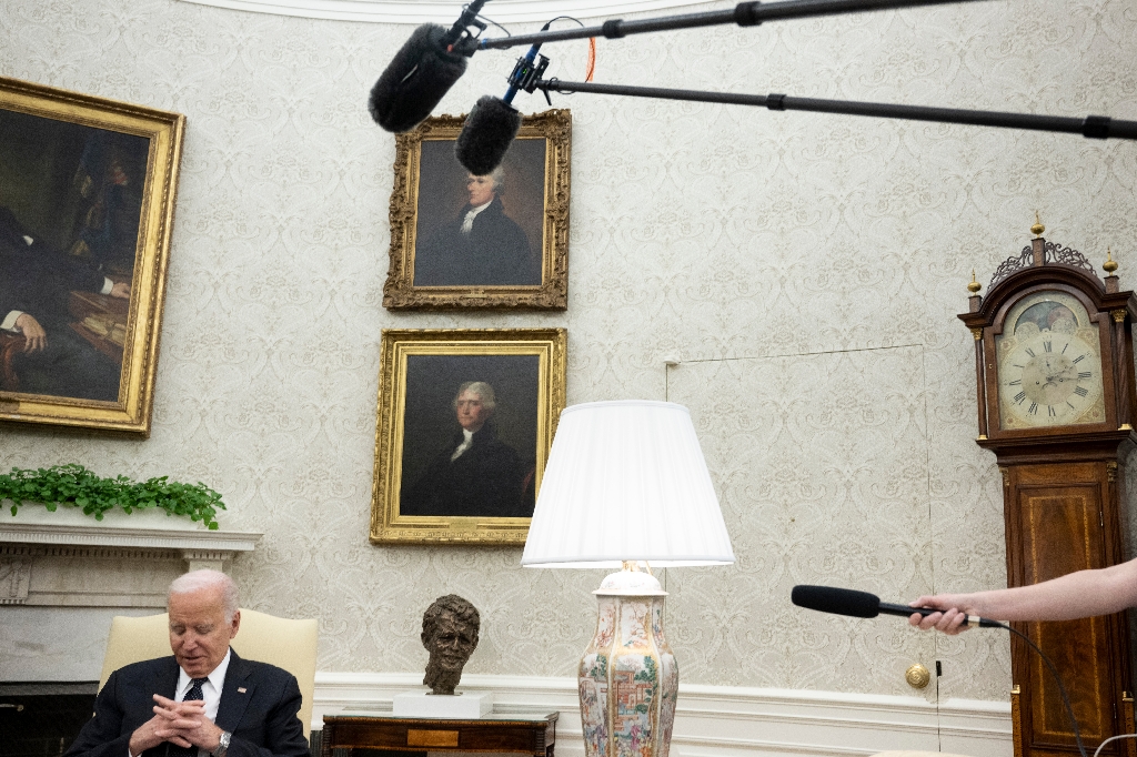 US President Joe Biden listens during a meeting with Romanian President Klaus Iohannis (out of frame) in the Oval Office -- but did not speak about Israel-Hamas ceasefire talks / ©AFP