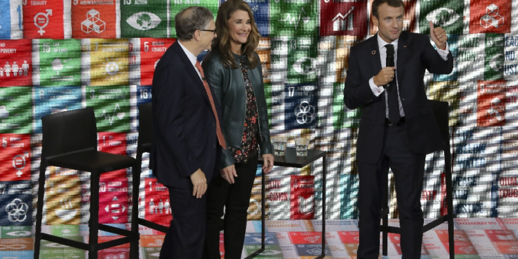 Melinda French Gates, pictured in 2018 with Bill Gates (left) and French President Emmanuel Macron, has pledged to use her fortune to help women and families  / ©AFP