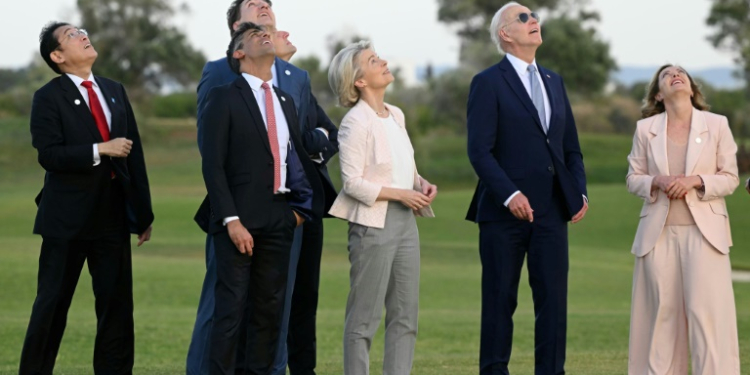 G7 leaders attend a skydiving demonstration at the San Domenico Golf Course in Savelletri, Italy . ©AFP