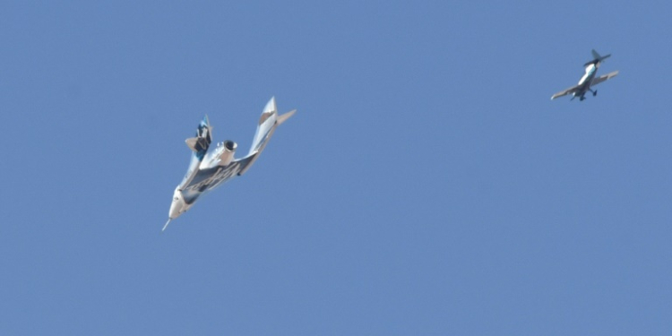 The Virgin Galactic SpaceShipTwo spaceplane Unity and mothership separate as they fly way above Spaceport America in New Mexico in July 2021 on the way to the cosmos. ©AFP