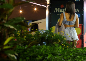 A woman walks in Lleras park in Medellin -- the city expects a record number of visitors this year. ©AFP