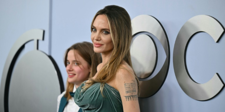 US actress Angelina Jolie (R), seen with daughter Shiloh, is one of the producers of 'The Outsiders,' which won the Tony Award for best musical. ©AFP