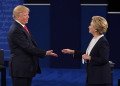 Democratic candidate Hillary Clinton and Republican candidate Donald Trump shake hands after a vicious US presidential debate at Washington University in St. Louis, Missouri, on October 9, 2016 / ©AFP