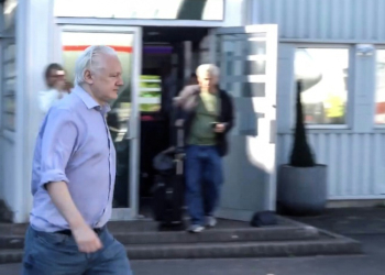 This screenshot courtesy of WikiLeaks's X page shows Julian Assange walking to board a plane from London Stansted Airport on June 24, 2024. ©AFP