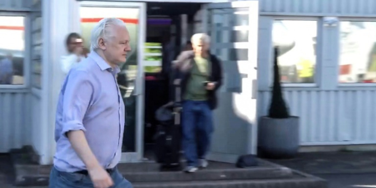 This screenshot courtesy of WikiLeaks's X page shows Julian Assange walking to board a plane from London Stansted Airport on June 24, 2024. ©AFP