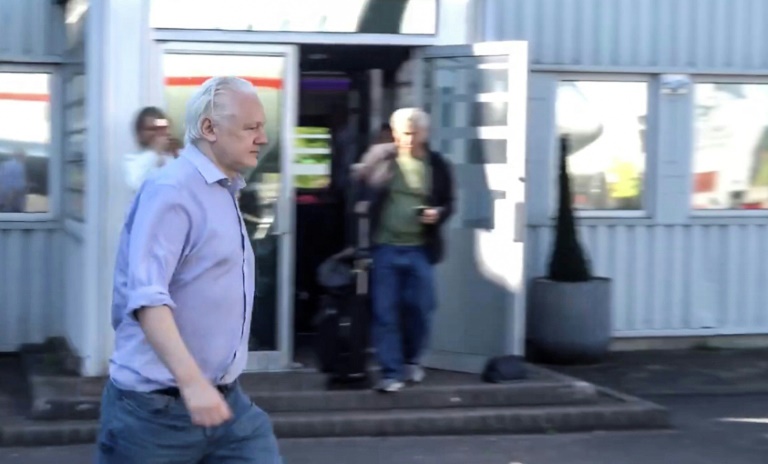 This screenshot courtesy of WikiLeaks's X page shows Julian Assange walking to board a plane from London Stansted Airport on June 24, 2024. ©AFP