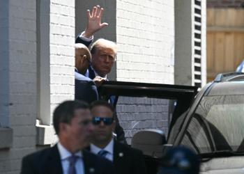 Former US president Donald Trump waves as he departs the Capitol Hill Club following a meeting with US House Republicans on Capitol Hill in Washington, DC, on June 13, 2024 / ©AFP