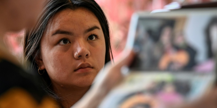 Loulee Wilson, an American college student, was born in China but given away by parents presumed fearful of violating the country's one-child policy. ©AFP