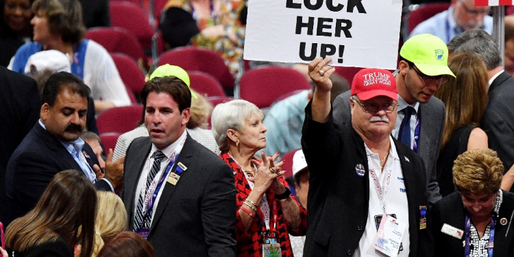 Former US president Donald Trump claimed he didn't say lock her up, the popular chant among his supporters (such as this one pictured at the 2016 Republican National Convention) about election rival Hillary Clinton / ©AFP