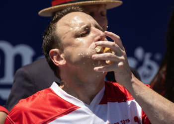 Joey Chestnut set a world record in winning the Nathan's Famous Fourth of July Hot Dog Eating Contest on Coney Island in New York in 2022 -- but this year, he is out of the competition. ©AFP