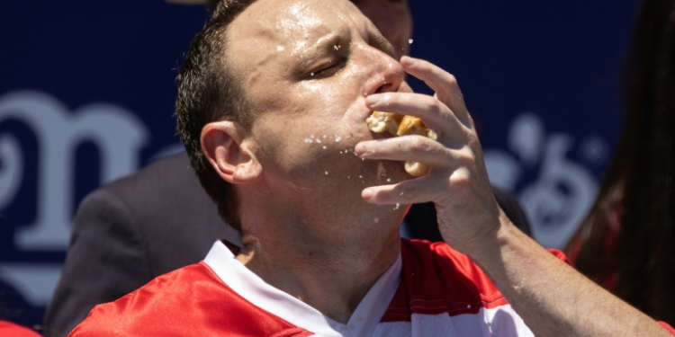 Joey Chestnut set a world record in winning the Nathan's Famous Fourth of July Hot Dog Eating Contest on Coney Island in New York in 2022 -- but this year, he is out of the competition. ©AFP