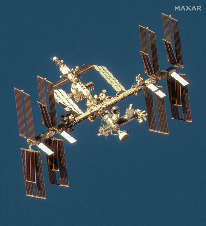 This handout image courtesy of Maxar Technologies taken on June 7, 2024 shows the Boeing Starliner spacecraft docked with the International Space Station's (ISS) forward port on the station's Harmony module. ©AFP