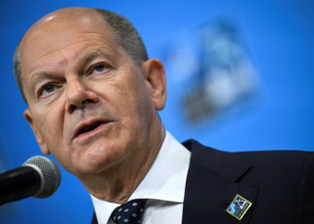 German Chancellor Olaf Scholz speaks to reporters at the NATO 75th anniversary summit in Washington, where he hailed a US decision to temporarily station some long-range missiles in Germany. ©AFP