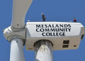 Wind turbine technician Terrill Stowe stands on the nacelle, which houses the gearbox and generator, atop the tower of a wind turbine on the campus of Mesalands Community College in the former Route 66 town of Tucumcari, New Mexico. ©AFP