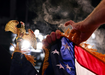 Flags are set up before the 2024 Republican National Convention at the Fiserv Forum on July 14, 2024 in Milwaukee, Wisconsin. ©AFP