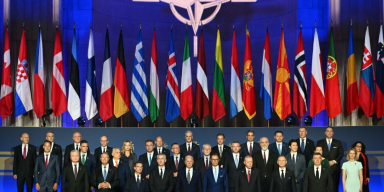 NATO leaders pose for a family photo during the NATO 75th anniversary celebration. ©AFP