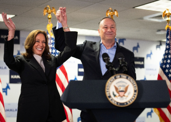 US Vice President and Democratic presidential candidate Kamala Harris and Second Gentleman Doug Emhoff acknowledge the crowd before speaking at her campaign headquarters in Wilmington, Delaware, on July 22, 2024.  Harris on January 22, won the crucial backing of Democratic heavyweight Nancy Pelosi to lead the party against Donald Trump in November after Joe Biden's stunning exit from the 2024 race. As the endorsements stacked up, the 59-year-old Harris made her first public appearance since Biden's announcement in a ceremony at the White House where she warmly praised the outgoing president's unmatched achievements.  / ©AFP