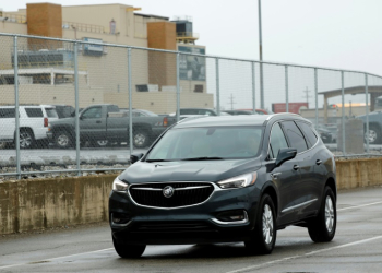 General Motors reported higher profits behind strong  North American sales of the GMC Sierra and other conventional internal combustion engine trucks . ©AFP