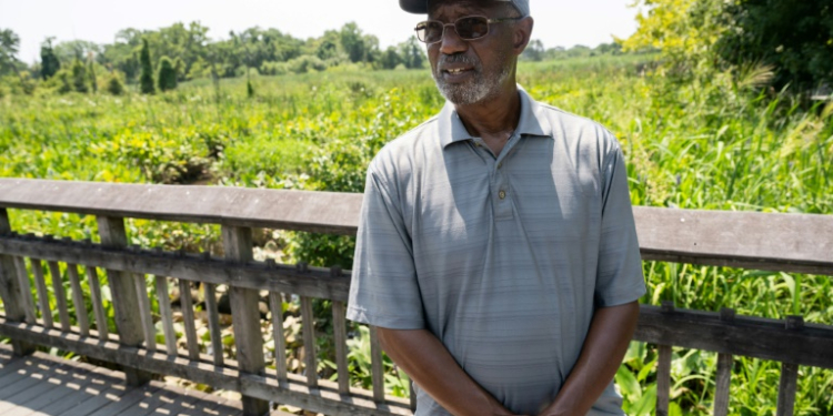 Dennis Chestnut, an advocate for making the Anacostia River swimmable, speaks with AFP from a lily pad garden near the river's banks. ©AFP