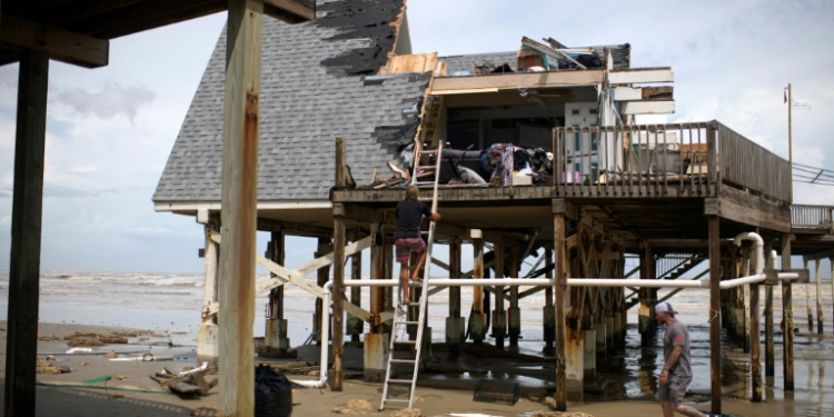 Mike Isbell inspects his destroyed waterfront home in Surfside Beach, Texas, after Hurricane Beryl made landfall. ©AFP