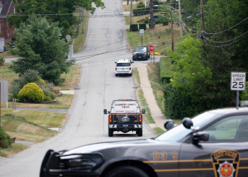 A police bomb squad car was seen driving towards the home of Thomas Matthew Crooks, the suspected shooter of former US president Donald Trump, as the FBI investigates the incident. / ©AFP