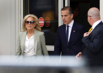 Hunter Biden (center) was convicted in Delaware in June on federal gun charges in a historic first criminal prosecution of the child of a sitting US president / ©AFP