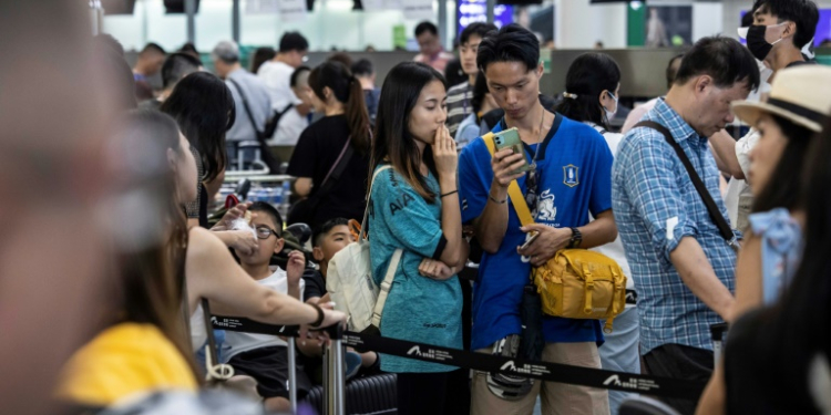 Passengers in airports around the world learned their flights had been delayed. ©AFP