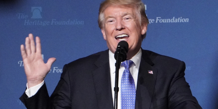 US President Donald Trump, seen giving a speech at a Heritage Foundation event in 2017, has sought to distance himself from its Project 2025 governing agenda / ©AFP