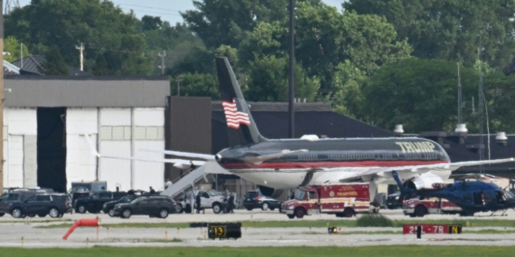 People disembark from former US president and Republican presidential candidate Donald Trump's plane after it landed at Milwaukee Mitchell International Airport, Wisconsin, on July 14, 2024. ©AFP