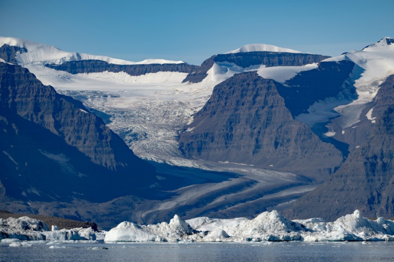 A photograph taken in Scoresby Fjord, Estarn Greenland shows a partly melted glacier. ©AFP