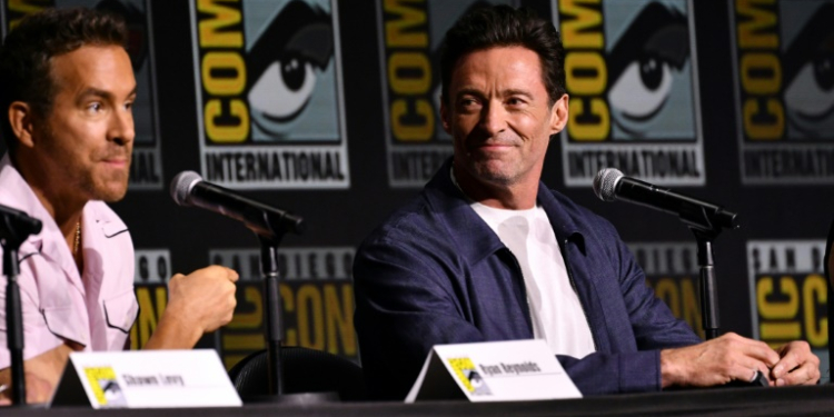 Ryan Reynolds (L), who co-wrote and acted in 'Deadpool & Wolverine,' joined friend and actor Hugh Jackman to discuss their new film at a Comic-Con panel in San Diego, California on July 26, 2024 . ©AFP