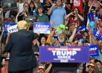 US President Donald Trump gestures at the crowd in Grand Rapids, Michigan, where he made a triumphant return to the campaign trail Saturday / ©AFP