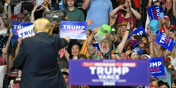 US President Donald Trump gestures at the crowd in Grand Rapids, Michigan, where he made a triumphant return to the campaign trail Saturday / ©AFP