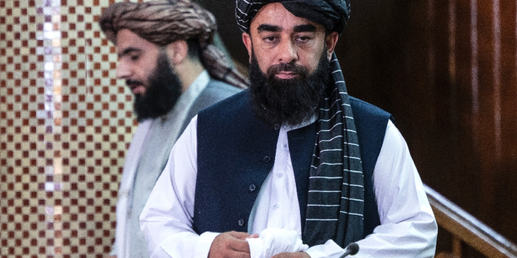 Taliban spokesman Zabihullah Mujahid arrives to attend a press conference in Kabul on July 3 / ©AFP