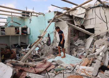 A Palestinian in a house hit by Israeli bombardment in Zawayda in the central Gaza Strip on July 7, 2024 / ©AFP