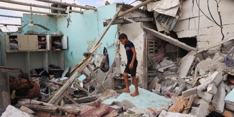 A Palestinian in a house hit by Israeli bombardment in Zawayda in the central Gaza Strip on July 7, 2024 / ©AFP