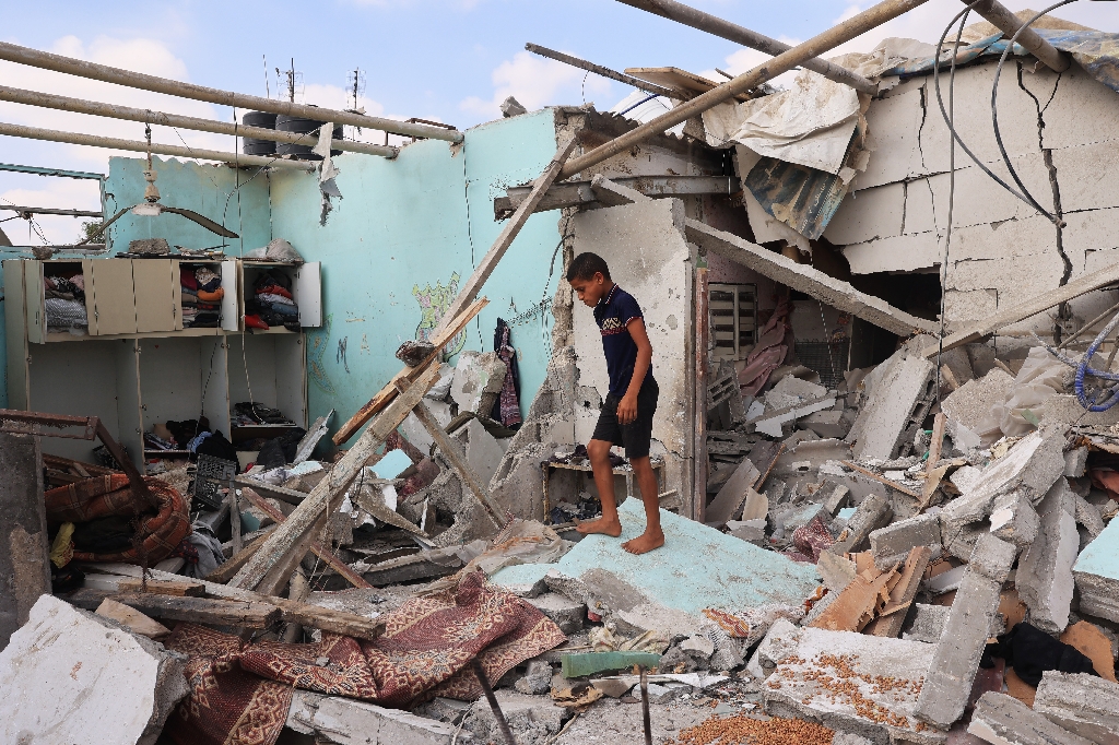 A Palestinian in a house hit by Israeli bombardment in Zawayda in the central Gaza Strip on July 7, 2024 / ©AFP