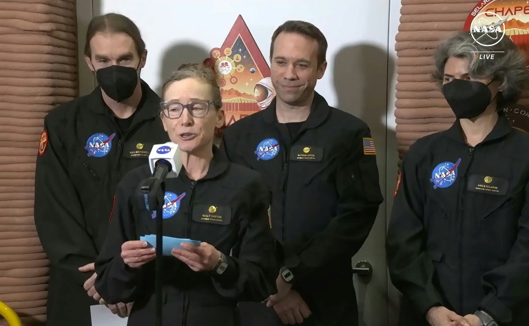 Volunteer crew commander Kelly Haston speaks alongside crewmates (L-R) Ross Brockwell, Nathan Jones and Anca Selariu, as they exit the first simulated Mars habitat mission at Johnson Space Center in Houston, Texas. ©AFP