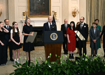 US President Joe Biden, standing alongside family members of the freed prisoners, speaks about the prisoner exchange with Russia, in the State Dining Room of the White House in Washington, DC, on August 1, 2024. Biden hailed the prisoner swap with Russia that saw the return of US journalist Evan Gershkovich and former US Marine Paul Whelan on Thursday as a feat of diplomacy that has ended their agony. / ©AFP