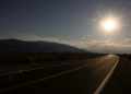 The sun sets over a highway in California . ©AFP