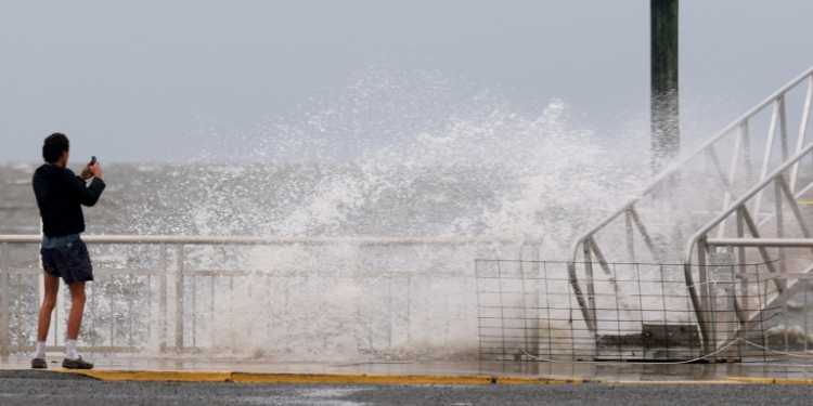 A wave crashes ashore in Cedar Key, Florida amid preparations for the arrival of Hurricane Debby. ©AFP